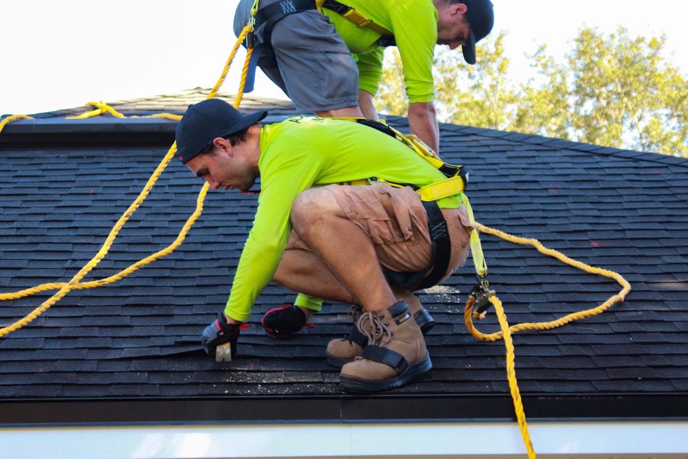 Roofing crew working on a residential roof