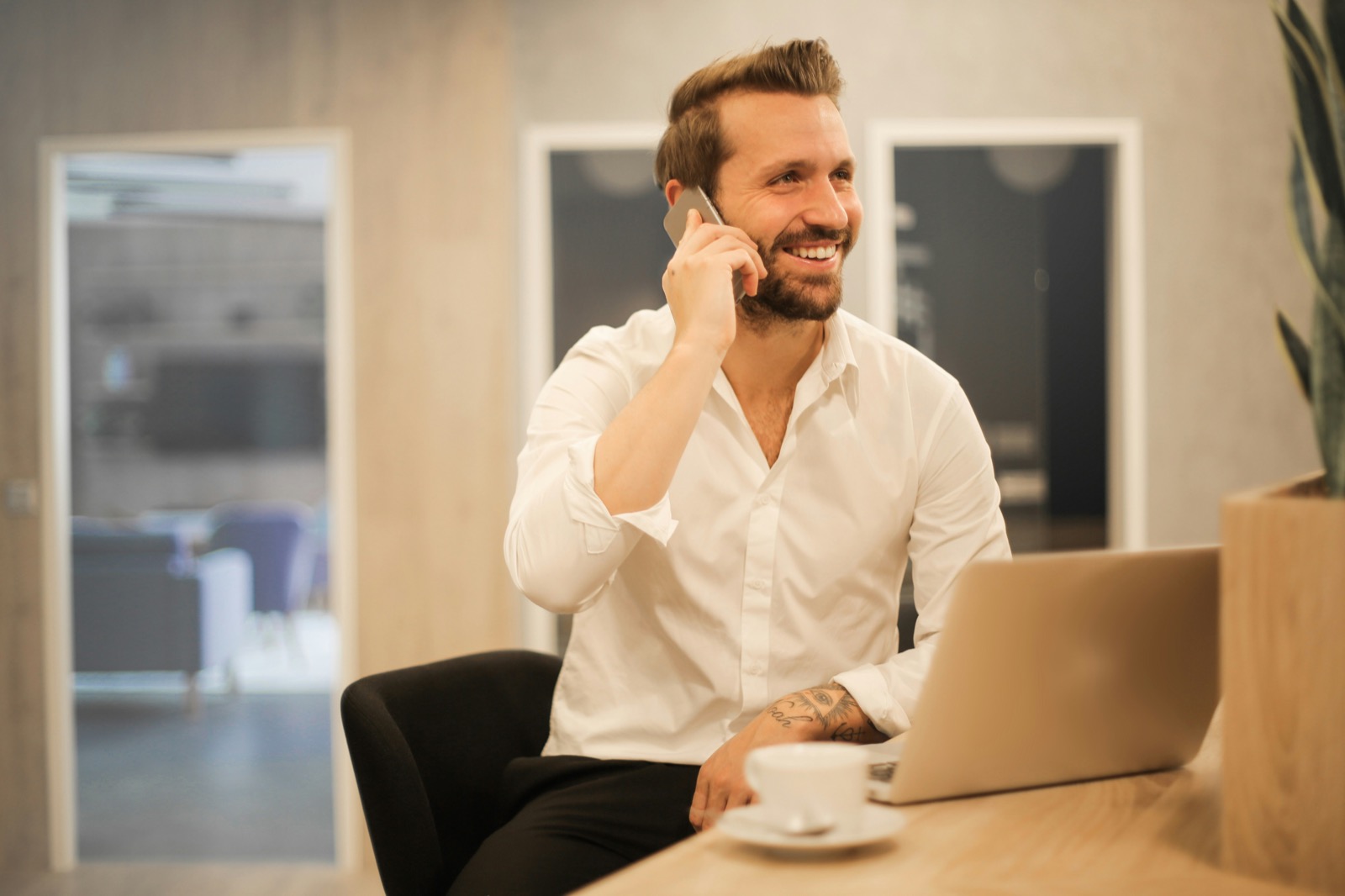 Local small business owner smiling while taking a call